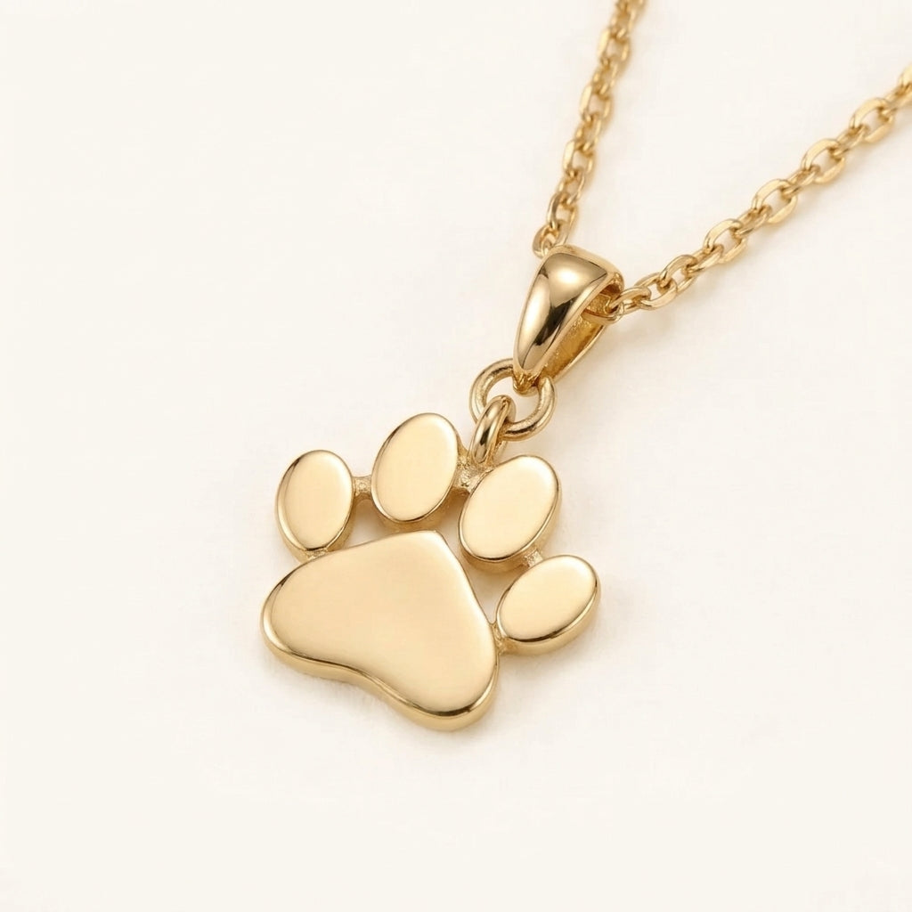 Caratly 18kt gold Paw Gold Pendant featuring a small, polished solid gold paw print charm on a delicate chain under Rs. 15,000