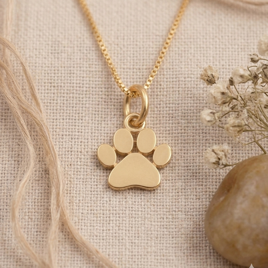 Caratly 18kt gold Paw Gold Pendant featuring a small, polished solid gold paw print charm on a delicate chain under Rs. 15,000