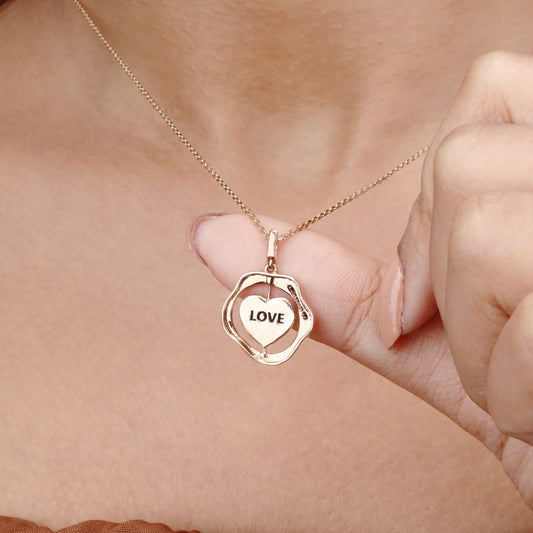 Caratly 18kt gold Love Gold Pendant featuring an organic wavy outer ring and a spinning inner circle engraved with the word LOVE under Rs. 50,000