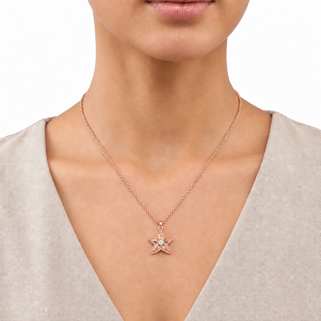 Rose gold starfish pendant necklace encrusted with sparkling stone priced under Rs. 70,000