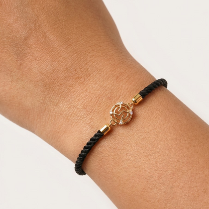 Black rope men's diamond bracelet with an 18kt gold Swastik charm and diamond accents. Gold and Diamond gift for him under Rs. 15,000