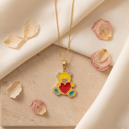 Gold enamel teddy bear pendant holding a red enamel heart, price under Rs. 25,000