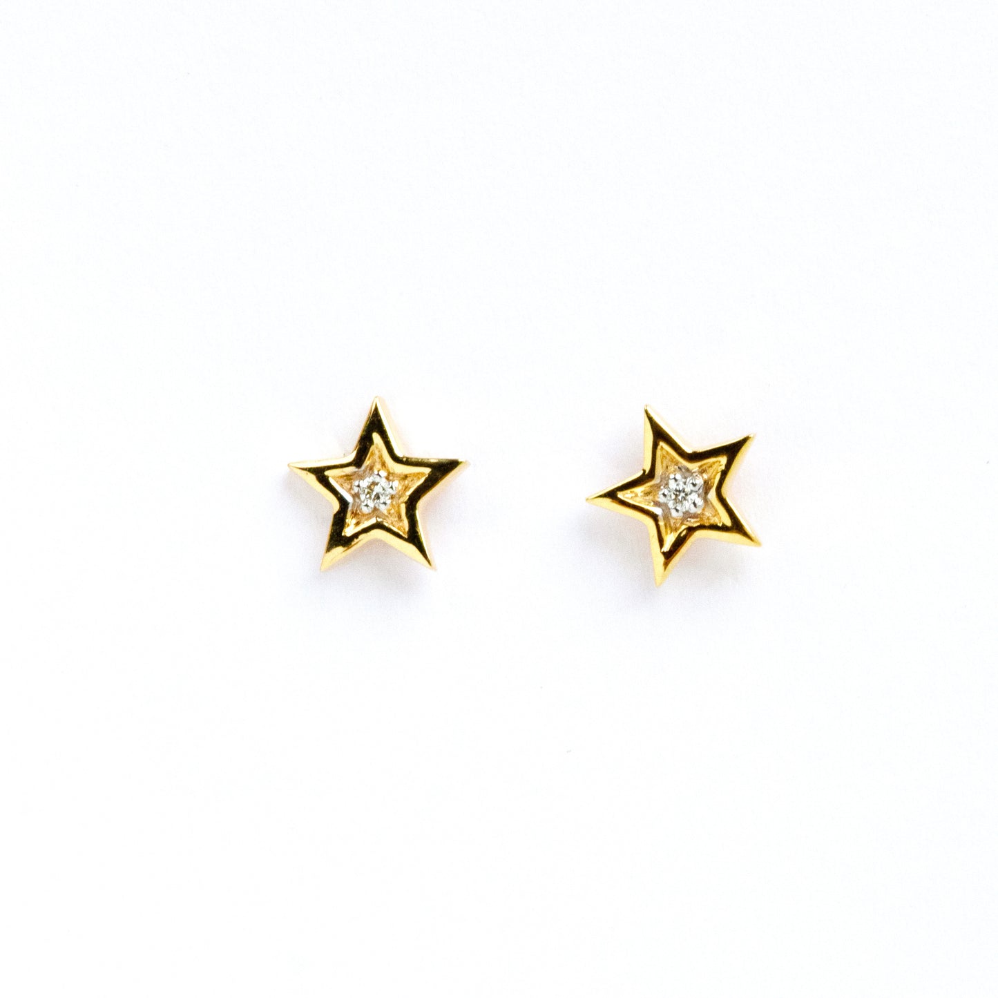 Caratly 18kt gold Star Diamond Earring with 0.02ct diamond center in a five-pointed star stud design. Perfect for gifting it to her under Rs. 20,000