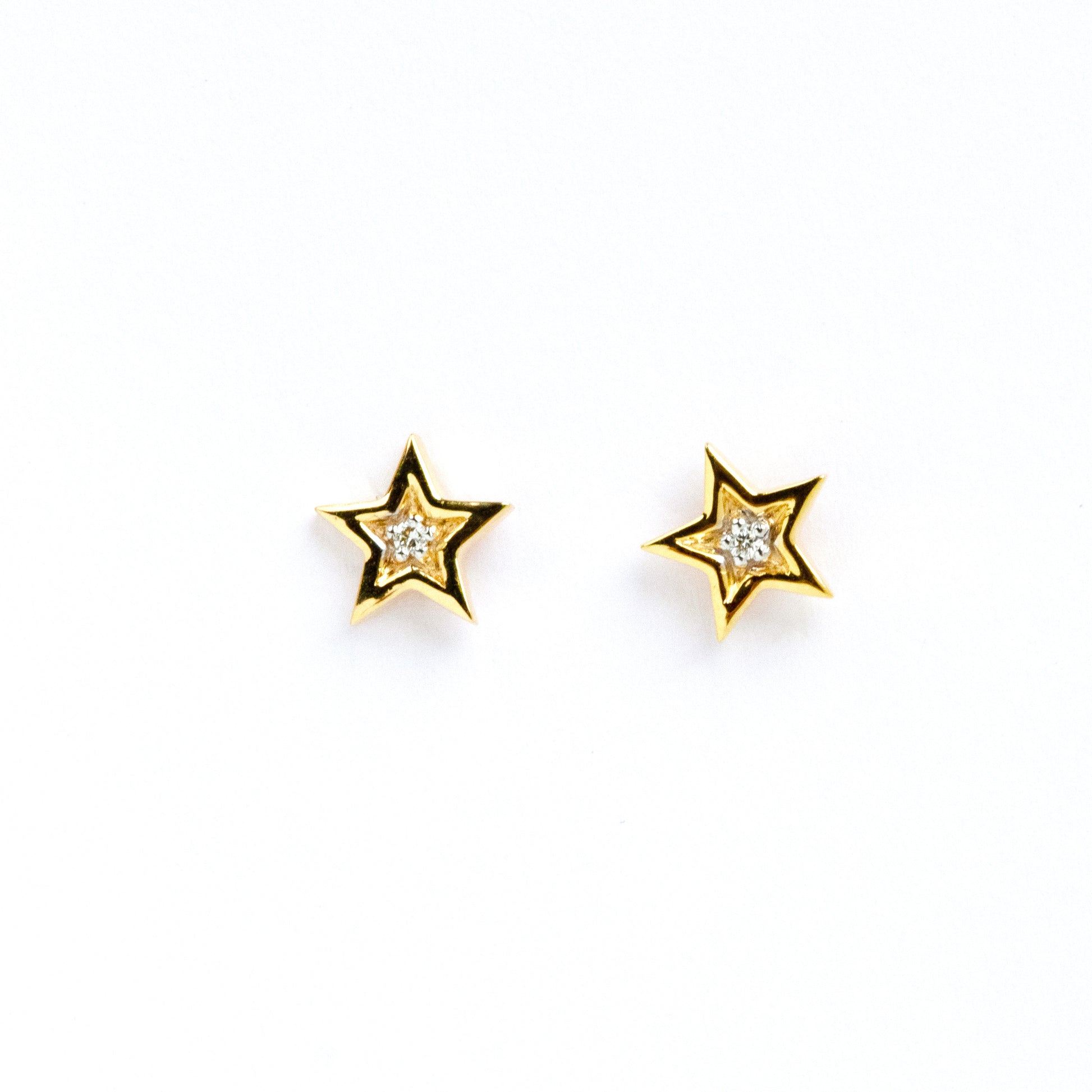 Caratly 18kt gold Star Diamond Earring with 0.02ct diamond center in a five-pointed star stud design. Perfect for gifting it to her under Rs. 20,000