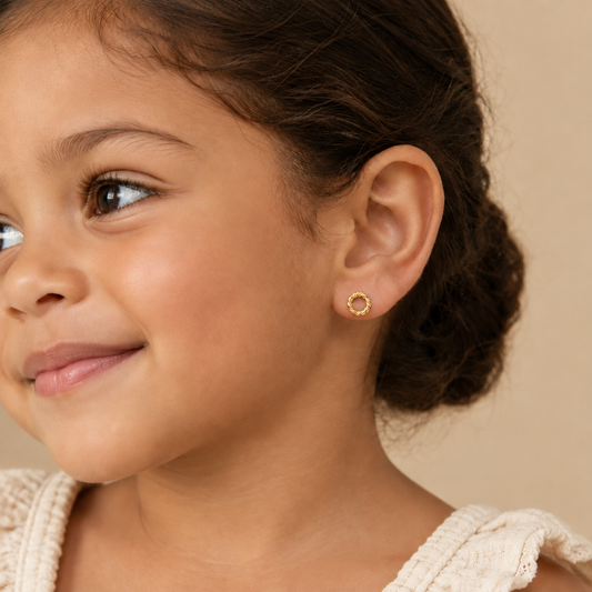 Pair of twisted rope-textured gold hoop stud earrings. Minimal gold earrings for gifting under Rs. 25,000