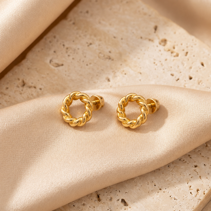 Pair of twisted rope-textured gold hoop stud earrings. Minimal gold earrings for gifting under Rs. 25,000
