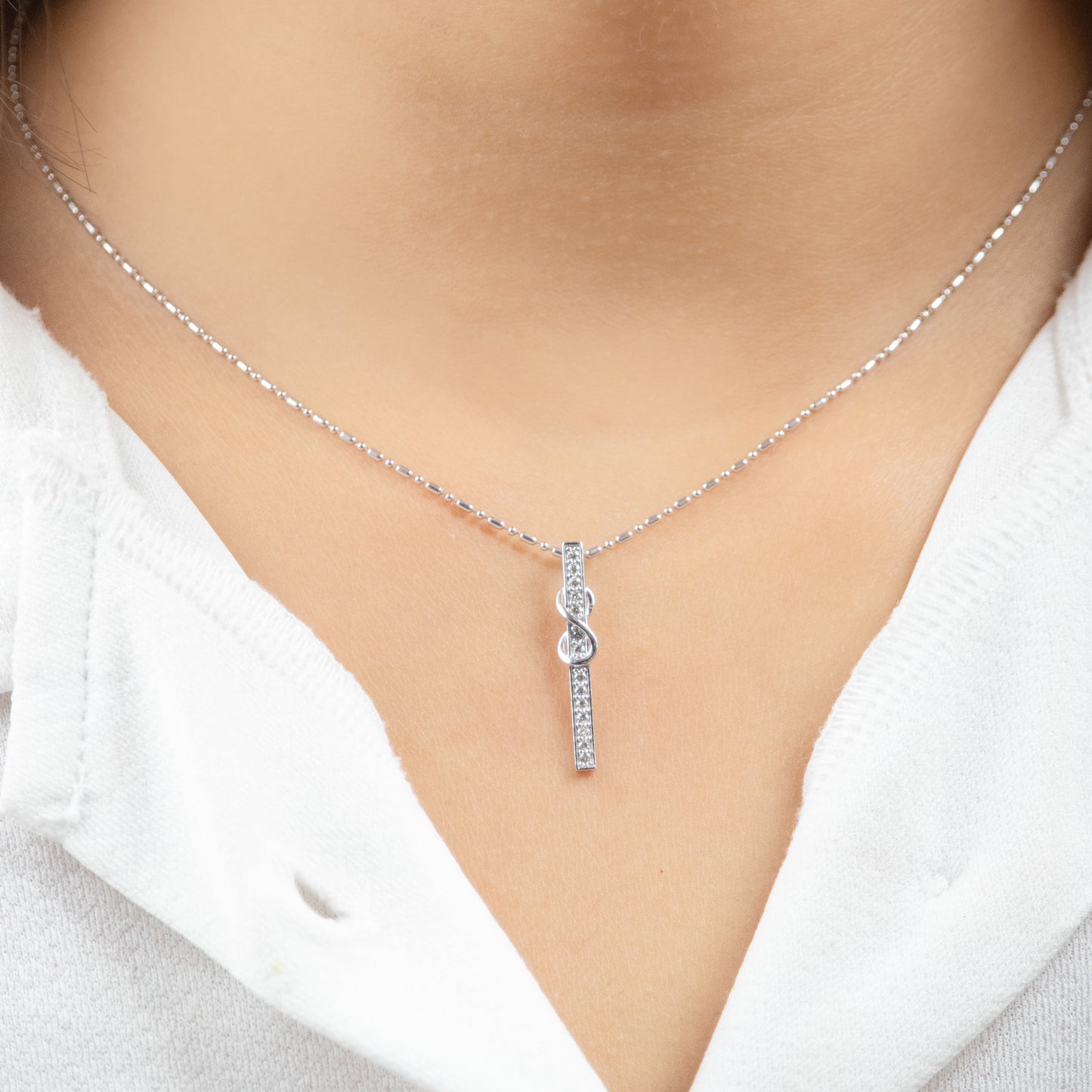 Caratly 18kt gold Infinity Bar Pendant with 0.13ct diamond vertical bar and infinity symbol design under Rs. 30,000