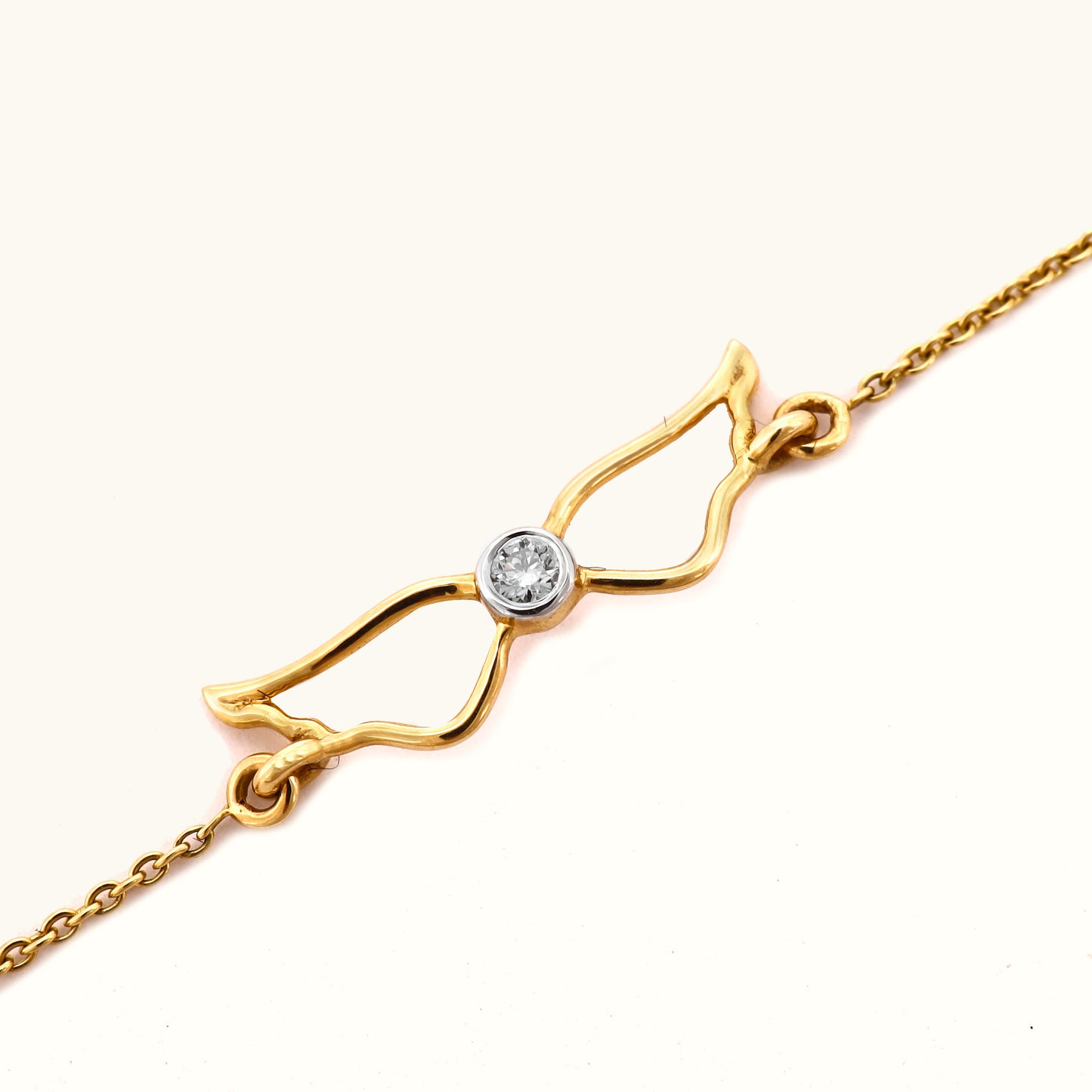 18kt gold Winged Diamond Bracelet with diamond. Accessible price range under Rs. 20,000